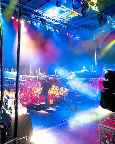 Backstage shot of a band performing to a packed show