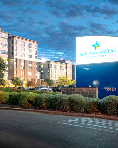 Baylor Scott & White sign with hospital in background